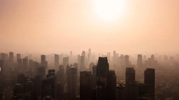 JAKARTA - Indonesia. October 12, 2018: Silhouette of Jakarta cityscape at dusk time with air polluted