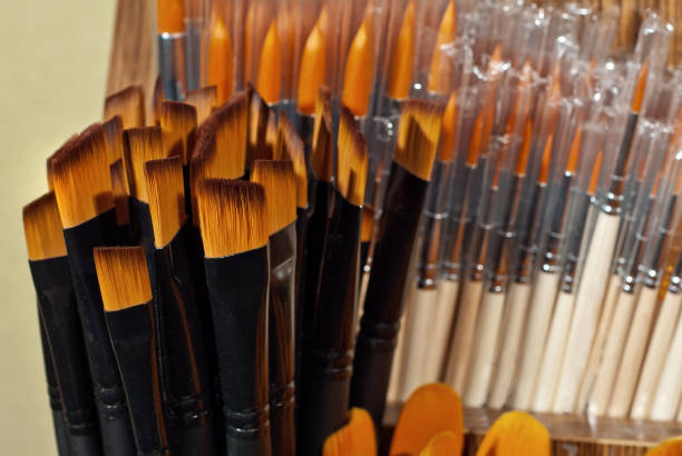 istock Brushes for drawing on a shelf in a shop 1055024250