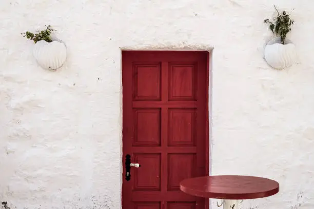 Traditional red wooden door in Bodrum, Turkey