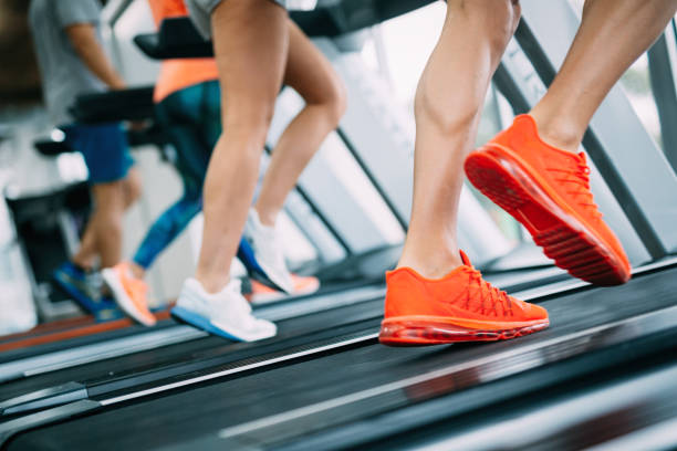 istock Group of friends exercising on treadmill machine 1055027434