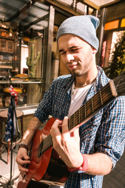 istock Energetic male guitarist making his guitar play 1055028936