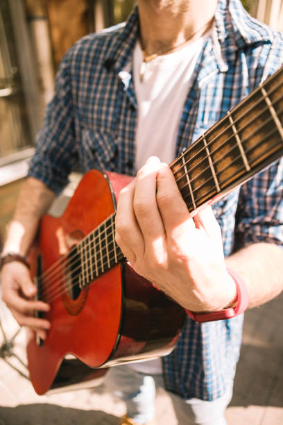 istock Active male guitarist reaching his right sound 1055028962