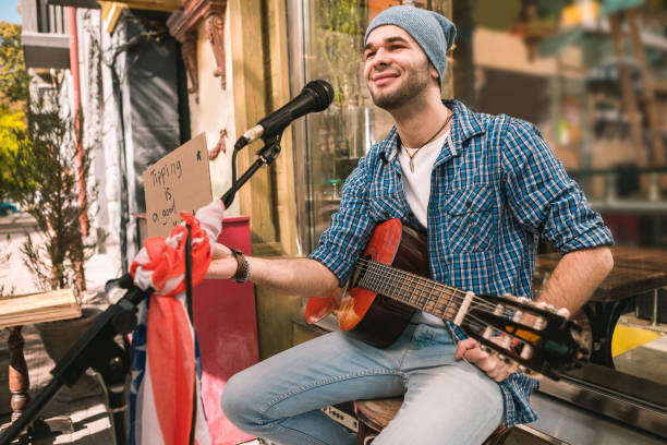 istock Satisfied male musician begging for tips after play 1055028980