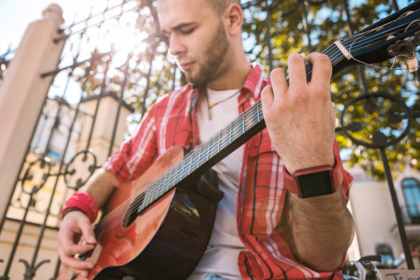 istock Handsome street musician making progress in music 1055029074