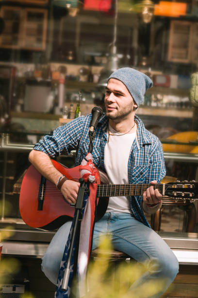 istock Pensive male guitarist developing his music skills 1055029194