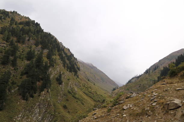 istock Scene of very big mountains under sky 1055035672