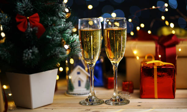 istock Two Glass Of Champagne Beside Christmas Tree 1055040434