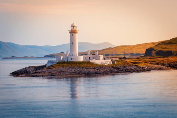 Eilean Musdile Lighthouse at Loch Linnhe, road to the Isle of Mull, Inner Hebrides, Isle of Skye, Scotland Eilean Musdile Lighthouse at Loch Linnhe, road to the Isle of Mull, Inner Hebrides, Isle of Skye, Scotland, United Kingdom oban stock pictures, royalty-free photos & images