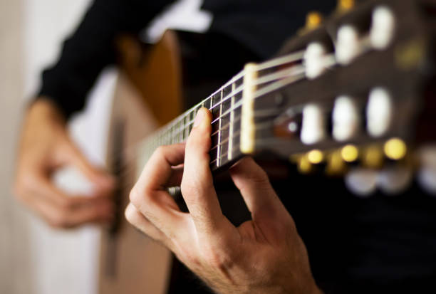 istock Man playing on acoustic guitar, music concept 1055041386