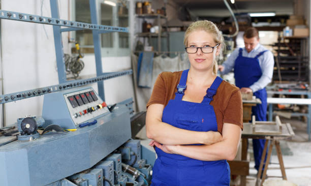 istock Confident female worker near glass beveling machine 1055043794