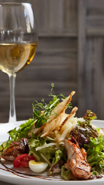 istock Chicken Salad. Chicken Caesar Salad. Caesar Salad with grilled chicken on plate. 1055044828