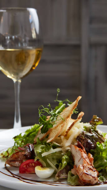 istock Chicken Salad. Chicken Caesar Salad. Caesar Salad with grilled chicken on plate. 1055044870