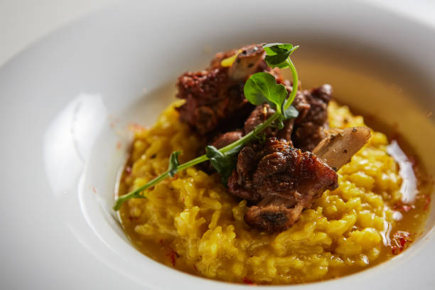 The ossobuco and saffron risotto. Shallow dof The ossobuco and saffron risotto. Shallow dof. ossobuco stock pictures, royalty-free photos & images