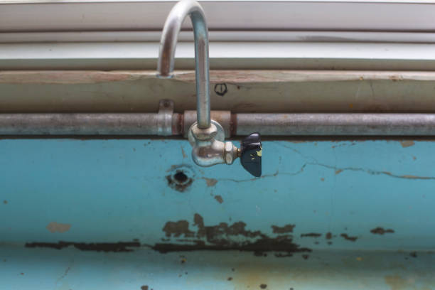 Old Water Tap in the Open and Water Drops