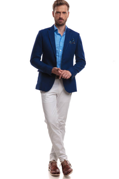 istock cool elegant man standing with legs crossed 1055045704