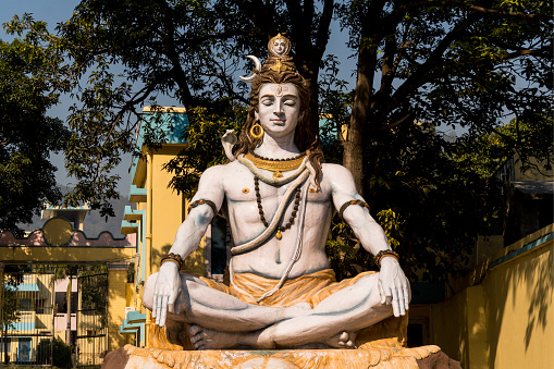 Haridwar, Uttarakhand, India –  May 02, 2023: Hindu devotee sitting in Lord Hanumana Temple at Haridwar, Uttrakhand, India.