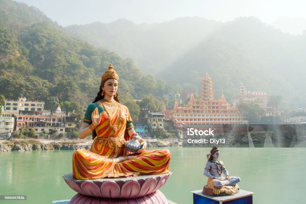 Statue of sitting goddess Parvati and Statue Shiva on the riverbank of Ganga in Rishikesh. Statue of sitting goddess Parvati and Statue Shiva on the riverbank of Ganga in Rishikesh Rishikesh Stock Photo