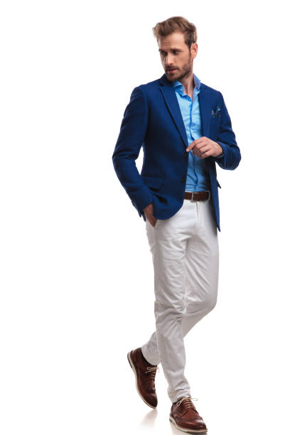 istock walking young smart casual man looks back over his shoulder 1055048066