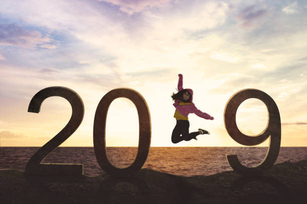 istock Female hip-hop dancer with number 2019 on beach 1055048968