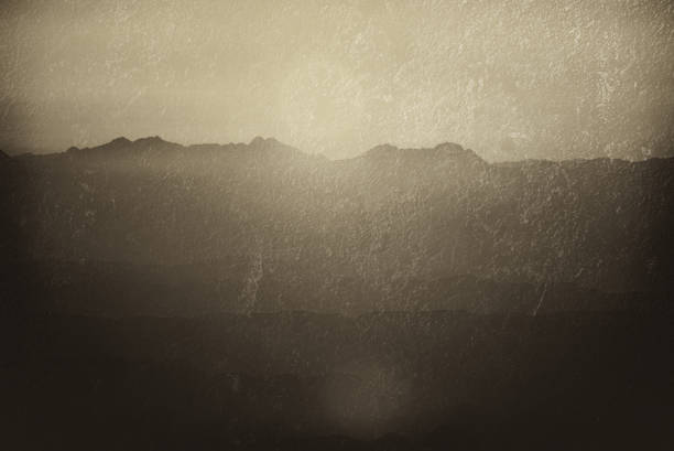 Double exposure Silhouette of mountains at sunset in the evening at dusk Mount Moses Sinai Egypt Landscape with aerial perspective, air fog texture effect