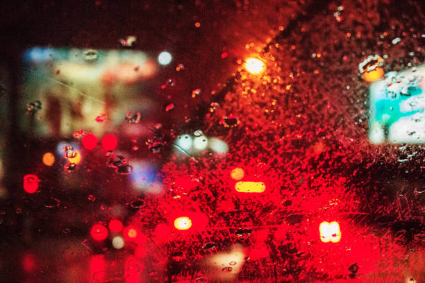 istock droplets on car glass at night. 1055053054