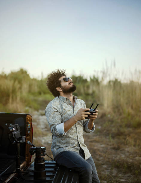 Man flying his drone, outdoors