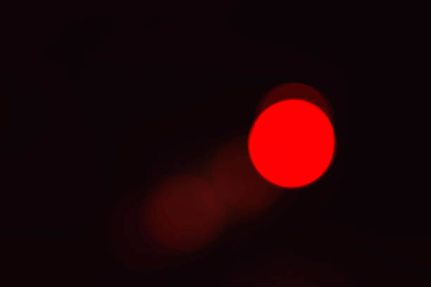 istock red of bokeh with black background. 1055053428