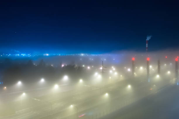 istock Thick fog over night highway in the city. 1055054700