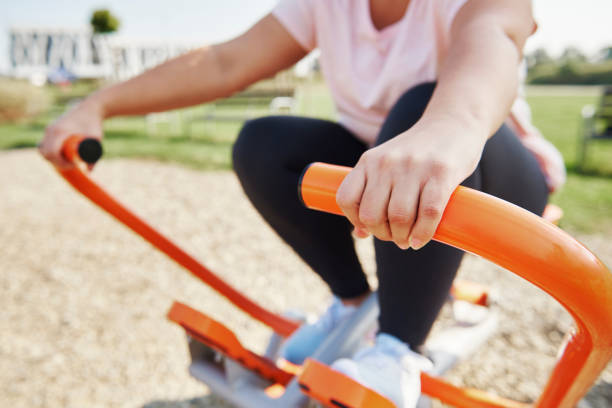 istock Woman exercising in the park 1055056324