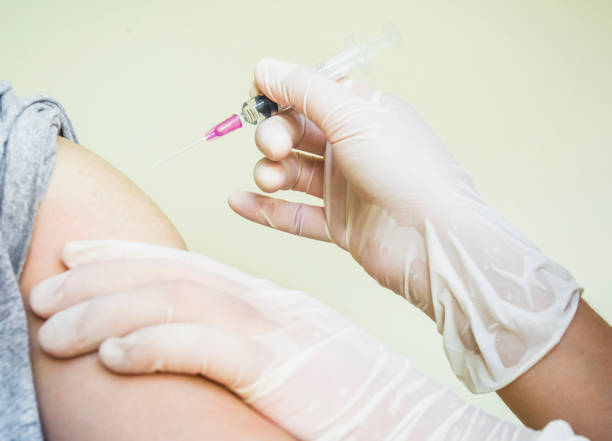 istock Doctor preparing a patient injection 1055056816