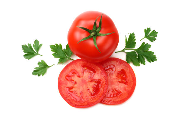 istock slice of tomato with parsley isolated on white background. top view 1055058664