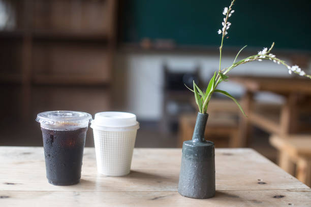 A cup of coffee on a wood table, side view ,americano