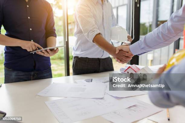 Engineers Handshake At Meeting Congratulations And Agreed To Do The Project Together Stock Photo - Download Image Now