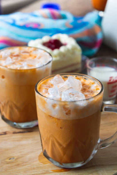 istock thai tea milkshank sweet drink on the glass for refreshment 1055059878