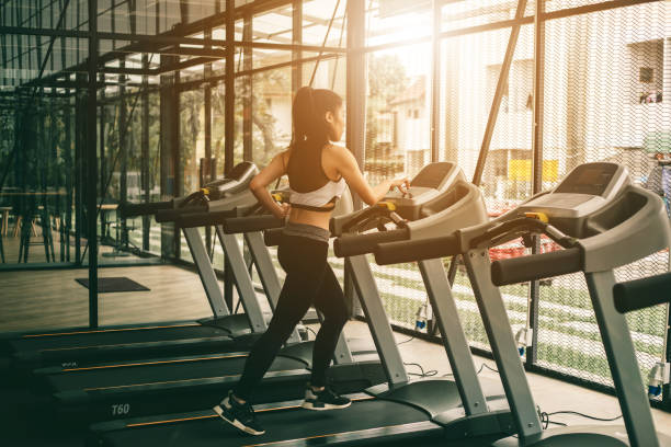 istock Woman running on treadmill at gym 1055060010