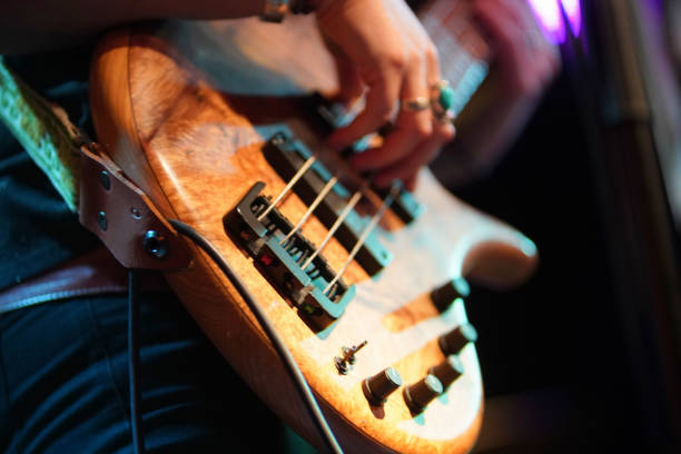 Bass player on stage Bass player on stage bass guitar stock pictures, royalty-free photos & images