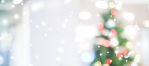 istock abstract blurred beautiful tree with ornate decoration in panoramic background for merry christmas and happy new year ; montage image or ads and banner design element 1055065120