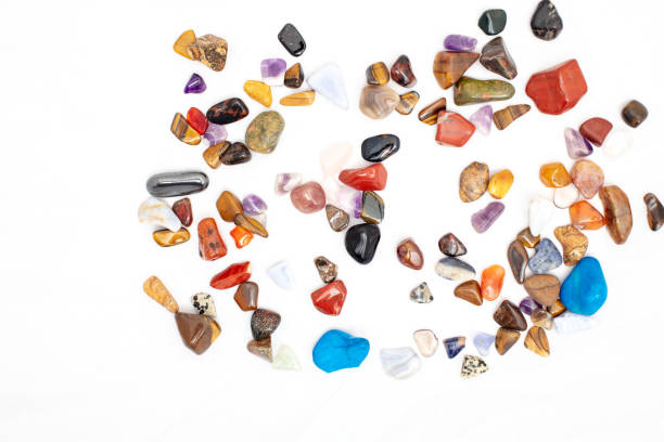 Colorful stones against white background stock photo