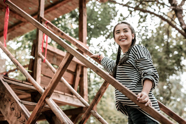 istock Amazing young woman keeping smile on face 1055070126