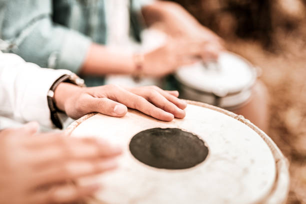 istock Focused photo on male hands that beating drum 1055070700