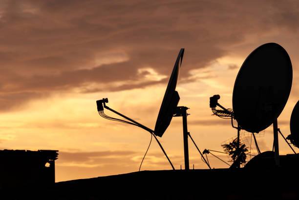 istock Antennas and chimneys on roof 1055071334
