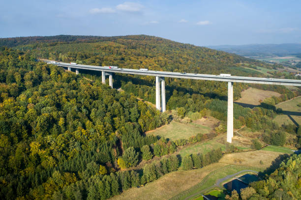 istock Highway bridge through forestland - aerial view 1055071474