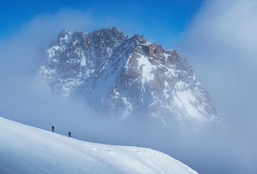 Italy. Courmayeur. Mont Blanc Massif. Climbers on a snowy slope in the Mont Blanc Region