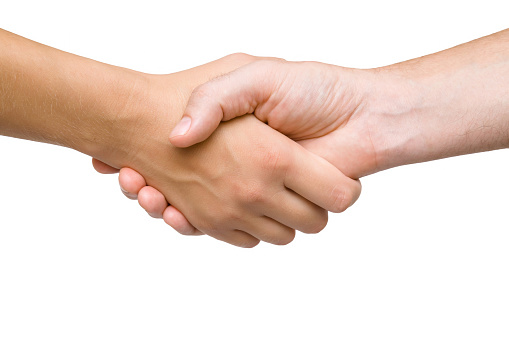 Man and woman shaking hands isolated on white background. Make and close deal. Two people. Promotion concept. Cutout human's arm. Close up. Clipping path.