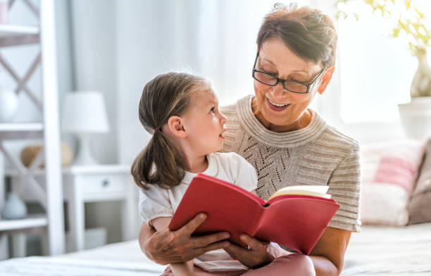 istock Grandmother reading a book 1055075034