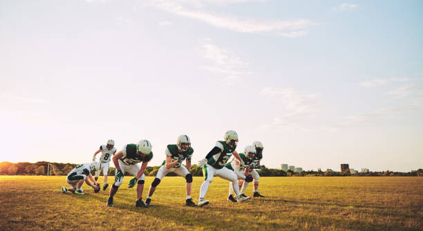 istock American football team doing place kicking drills during practice 1055079610