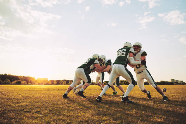 istock American football team doing defensive drills during a practice session 1055081106