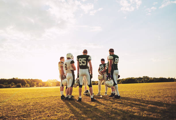 istock American football standing together on a field during practice 1055081274