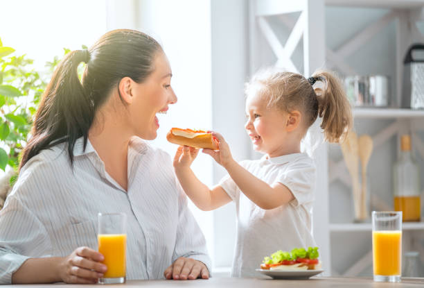 istock Happy family having breakfast. 1055082000
