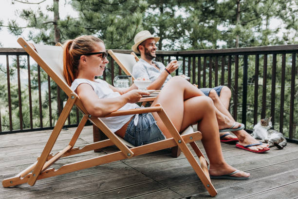 istock Couple enjoying coffee on a balcony in the mountains 1055084300